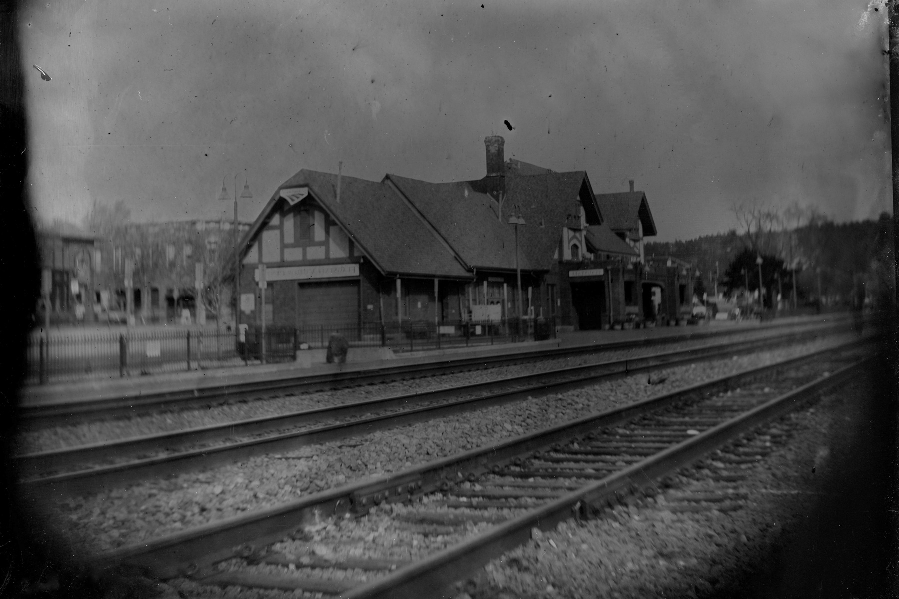 Black and white photograph of the Flagstaff train depot and railroad tracks